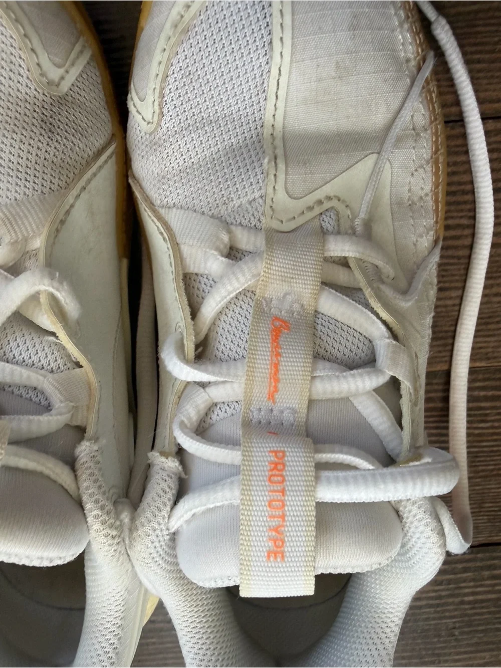 Nike White Basketball Sneakers with Orange Accents and Gum Sole